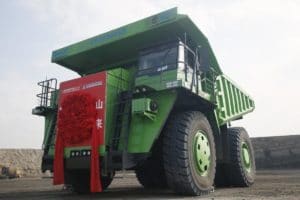 Huge electric dump truck goes to work at coal mine