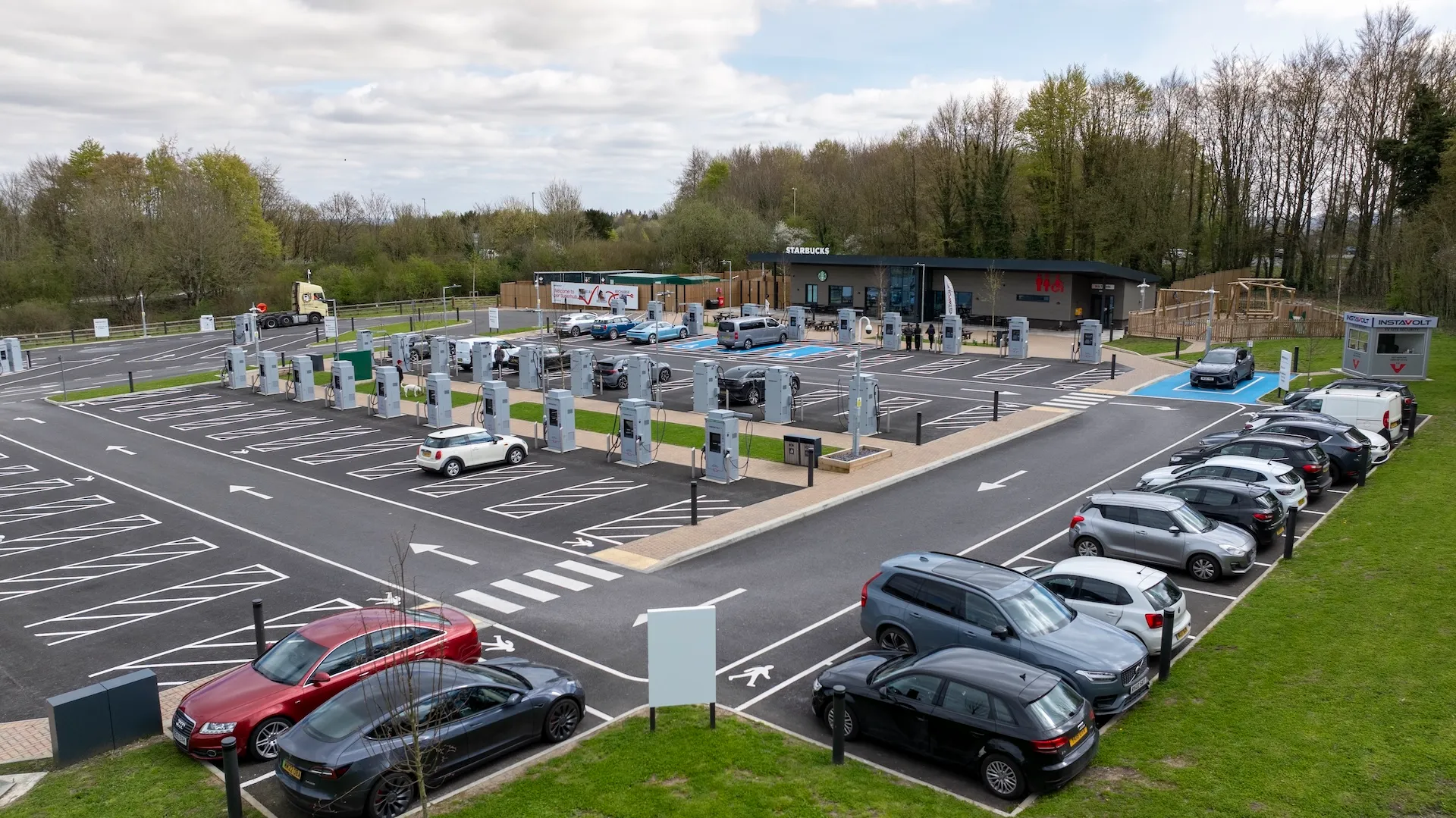 InstaVolt rapid EV charging stalls at a UK Superhub site, illustrating the network supported by the £250 million debt financing.