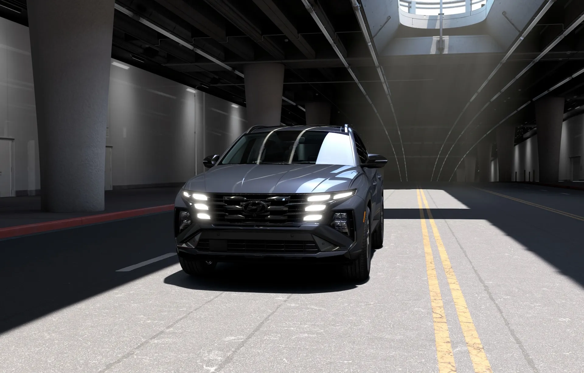 2026 Hyundai Tucson Hybrid Night AWD in Ecotronic Gray with gloss-black wheels, fascia, and window-surround trim