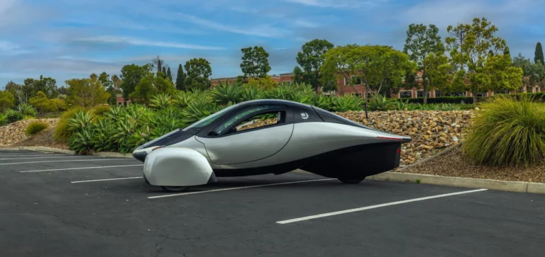 Aptera solar electric vehicle parked in sunlight during real-world solar charging validation.