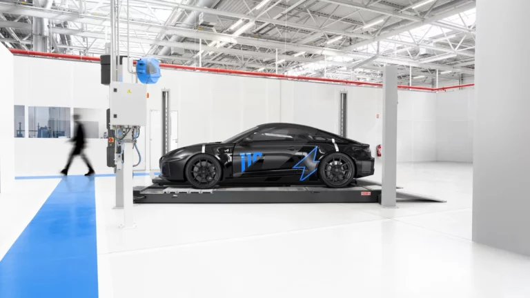 Black Alpine A110 FUTURE electric development mule on a chassis dynamometer