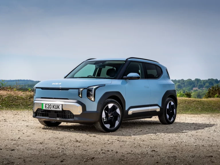Kia EV2 compact electric SUV in light blue, front three-quarter view, now eligible for the maximum UK Electric Car Grant