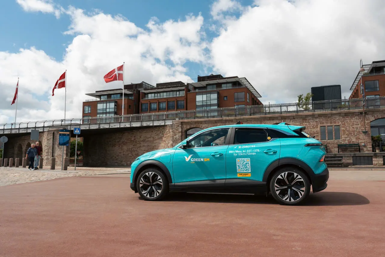 Green SM electric taxi in Copenhagen, part of the company's VinFast VF 6 and VF 8 fleet serving its first European market