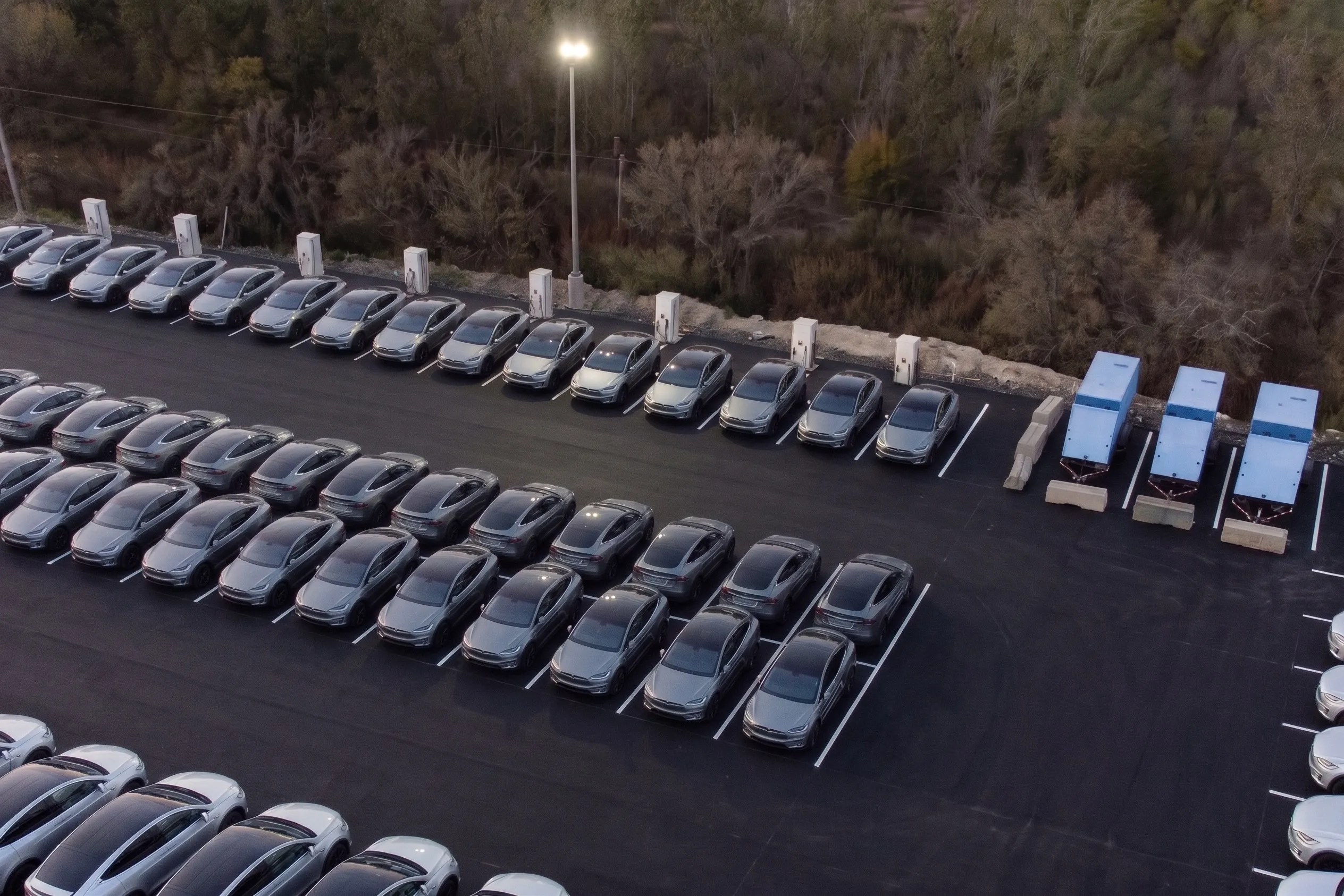 SparkCharge mobile battery energy storage unit delivering off-grid power to a commercial vehicle fleet depot