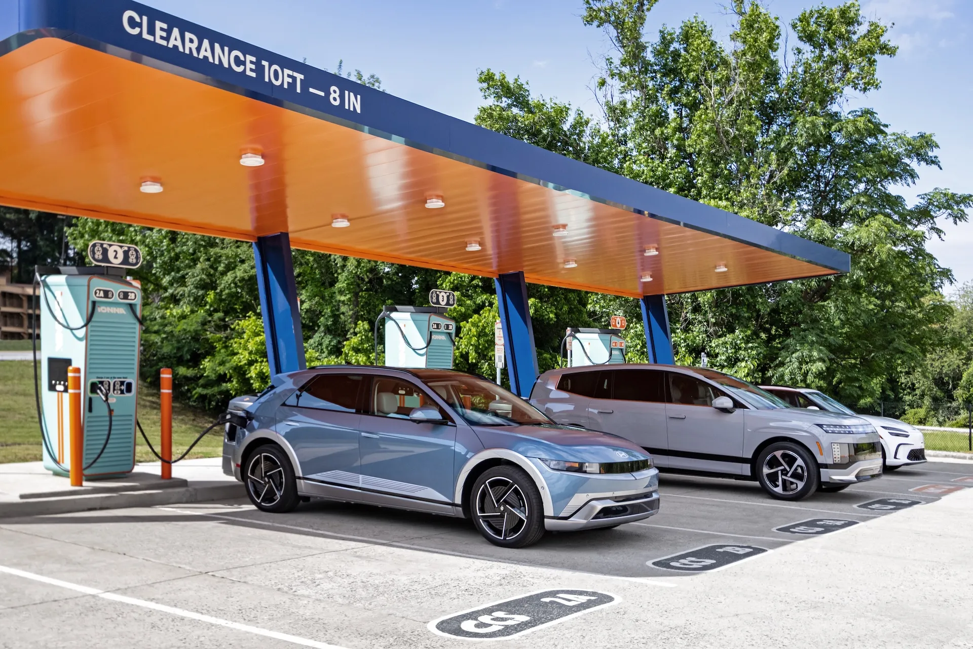 Hyundai IONIQ 5 and Genesis EVs charging at an IONNA Rechargery, where the Hyundai IONNA charging discount applies automatically.