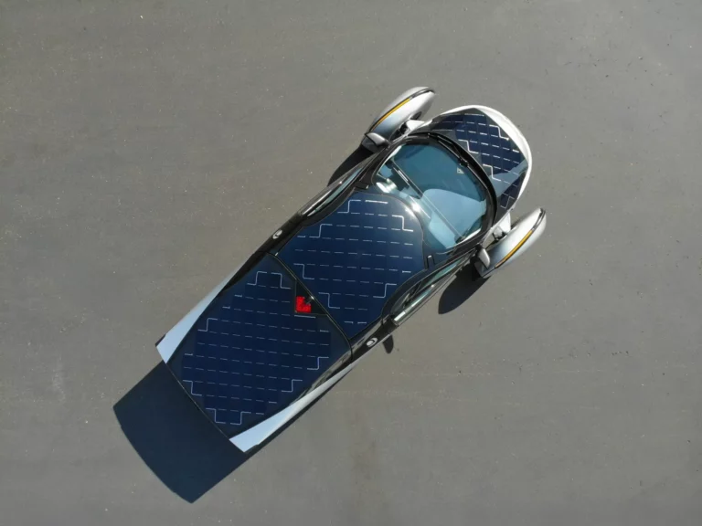 Top-down view of the Aptera solar electric vehicle showing integrated roof and hood solar panels measured in TÜV Rheinland testing