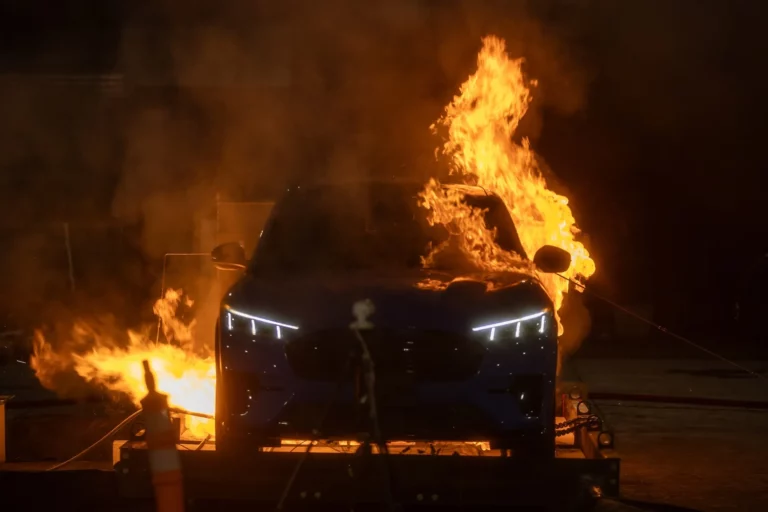 An electric vehicle burns during EV fire suppression experiments conducted by UL Research Institutes' Fire Safety Research Institute.