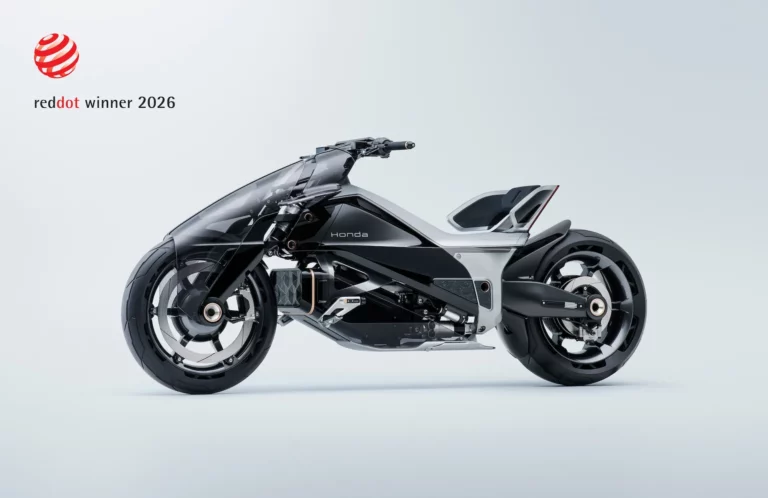 Honda EV Outlier Concept electric motorcycle with in-wheel motors on front and rear wheels, winner of the Red Dot Design Award 2026