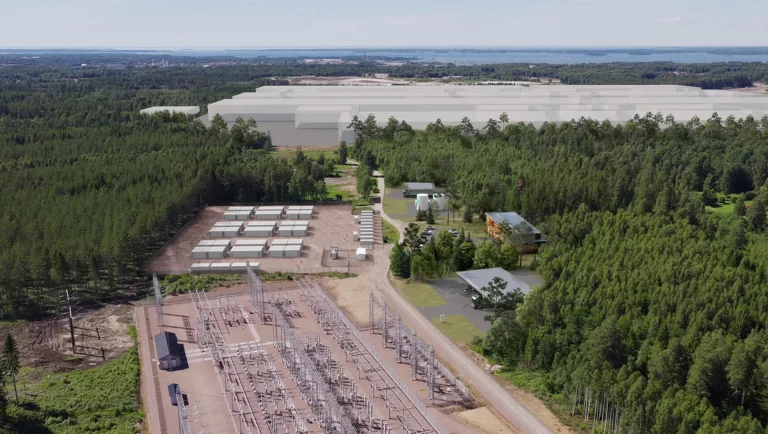Rendering of the Volvo Mariestad energy park showing containerized battery storage units, a substation, and the planned battery cell plant site in the background