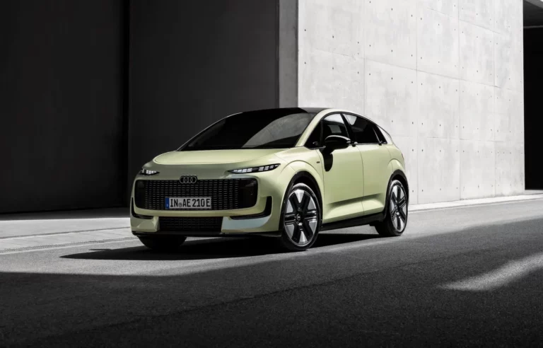 Audi A2 e-tron in pistachio green, side view, outdoor static shot