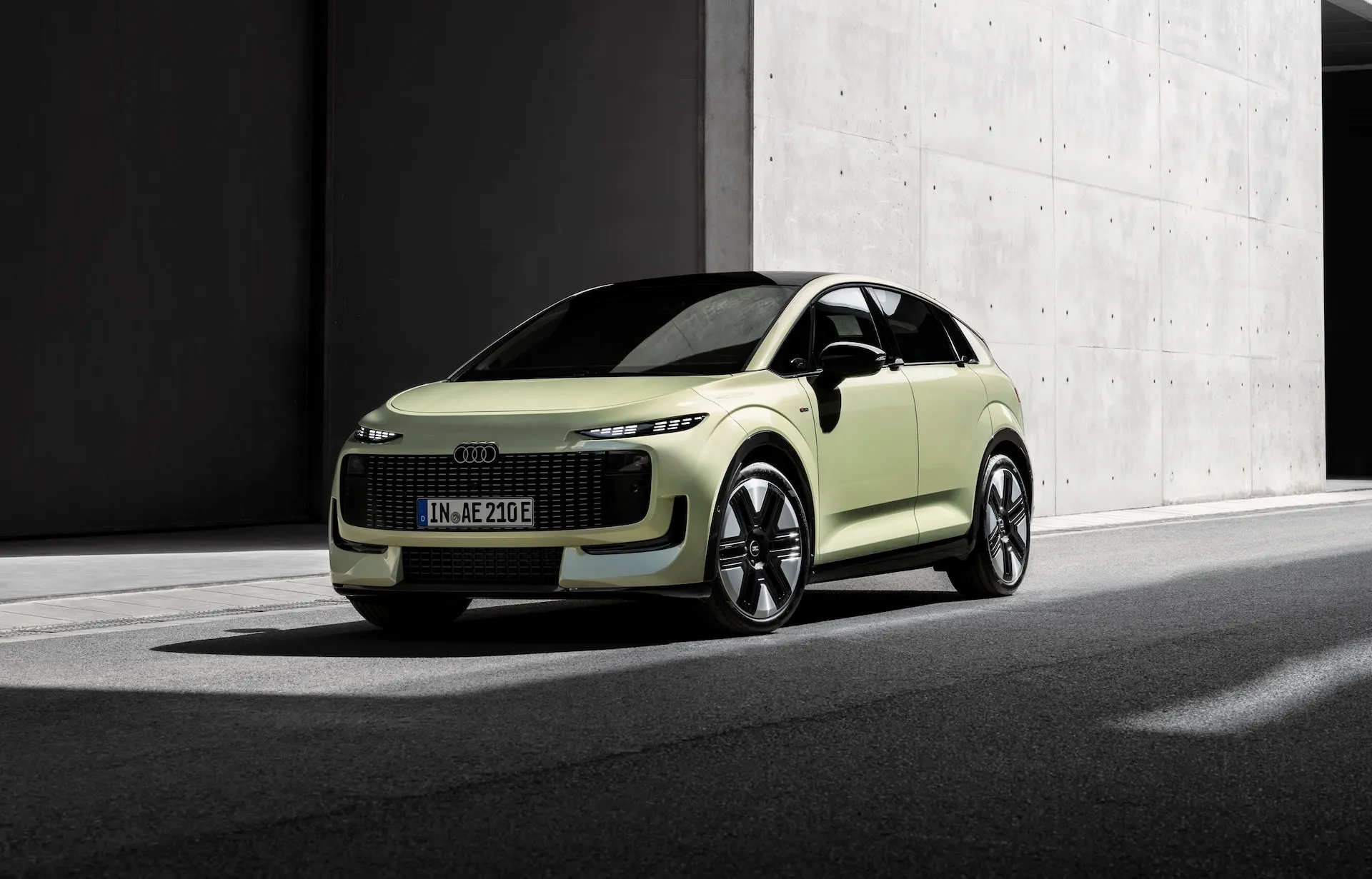 Audi A2 e-tron in pistachio green, side view, outdoor static shot