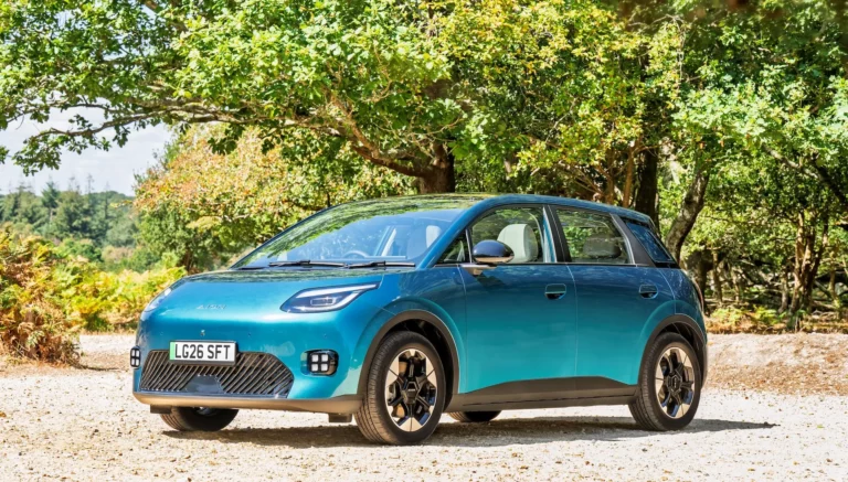 AION UT electric hatchback in red parked on a UK street at its September 2026 launch