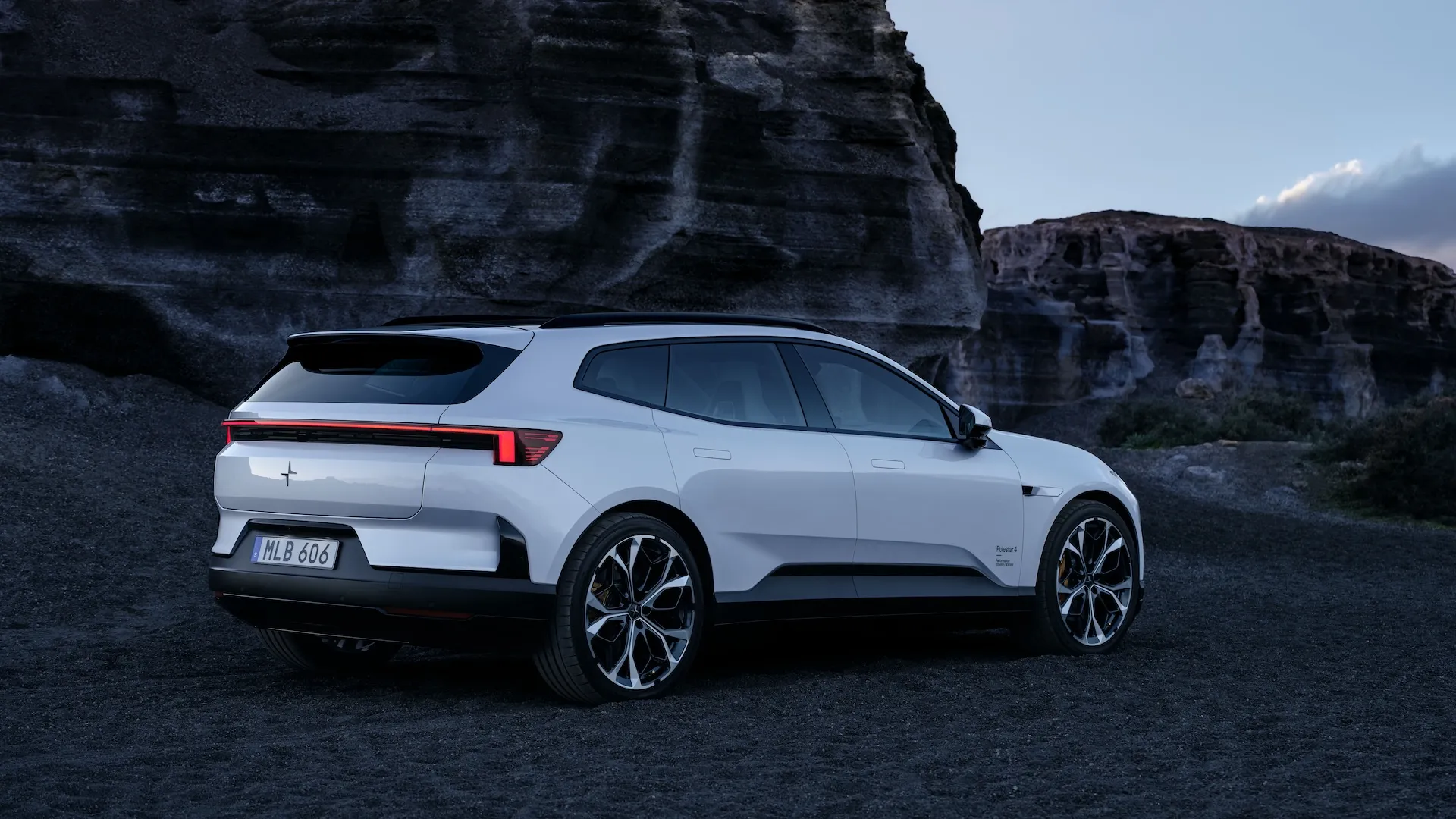 Polestar 4 SUV in Aurora silver green showing redesigned rear end and full-length roof rails