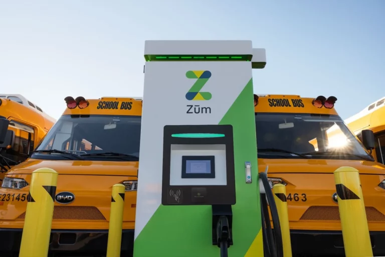 Zum electric school buses lined up at a San Francisco Unified School District charging site